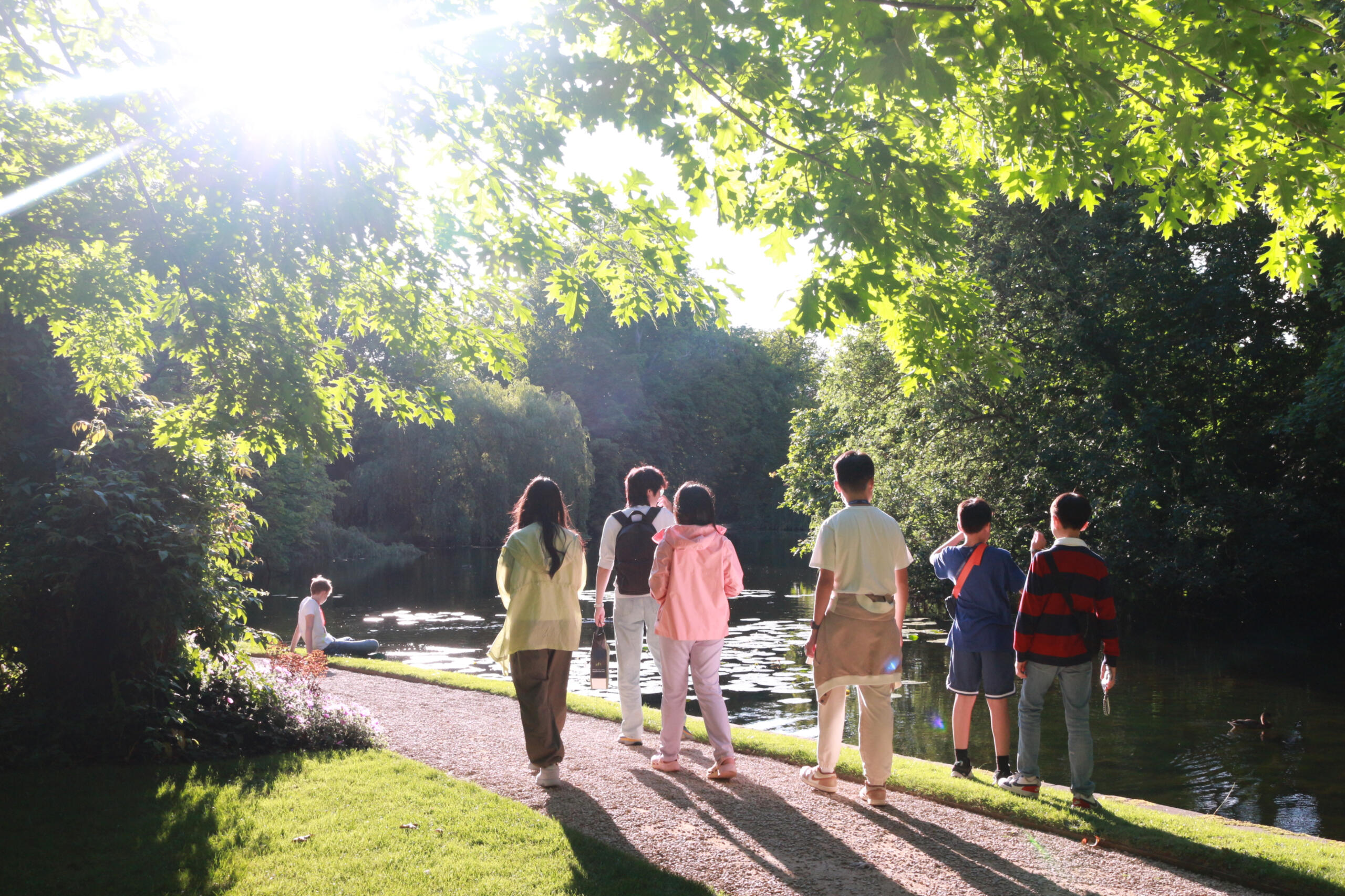 Children walking in a park.