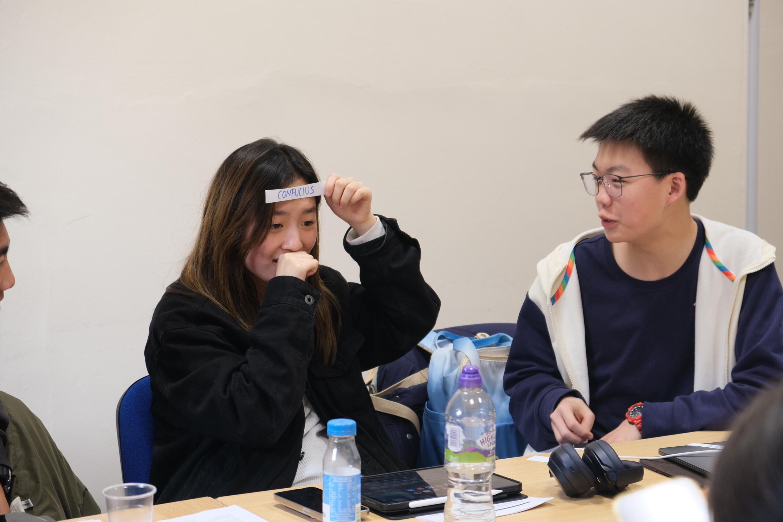Teenagers playing a game.